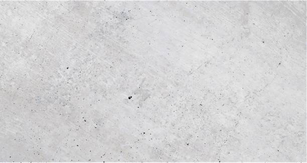 istock Cream white concrete wall with brushed diagonal structures and sleek texture in industrial design, grey cream white background. 1156992345