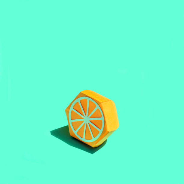 istock Paper half orange in bright sunshine 1156992462