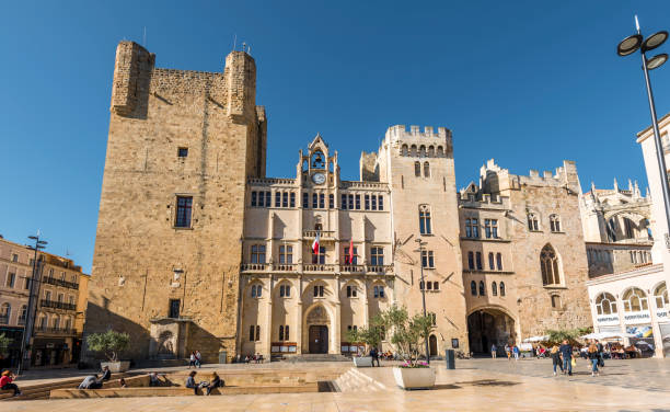 Front view of Narbonne City hall, historical palace of archbishops. Narbonne, France - October 30, 2016 Front view of Narbonne City hall, historical palace of archbishops. narbonne stock pictures, royalty-free photos & images