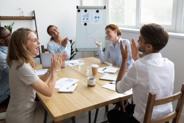 istock Diverse office workers team laughing and applauding at funny joke 1156995071