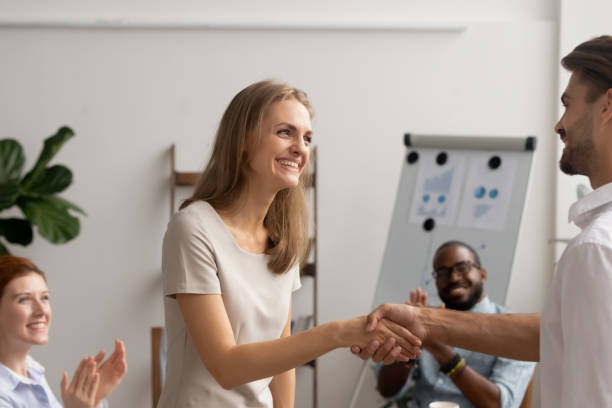 istock Young employee getting promotion handshaking with boss owner executive manager 1156995086
