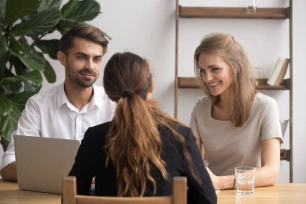 istock Friendly smiling partners meeting female client or job candidate 1156995105
