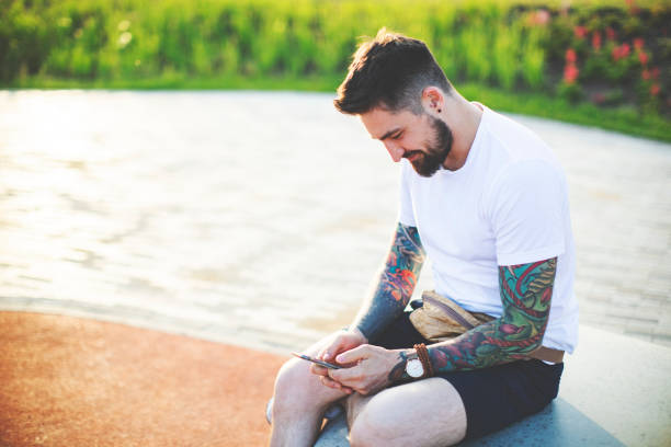 istock Portrait of tattooed man 1156996460