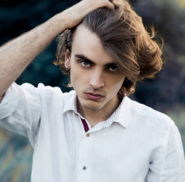 istock Young man in white shirt 1157001936