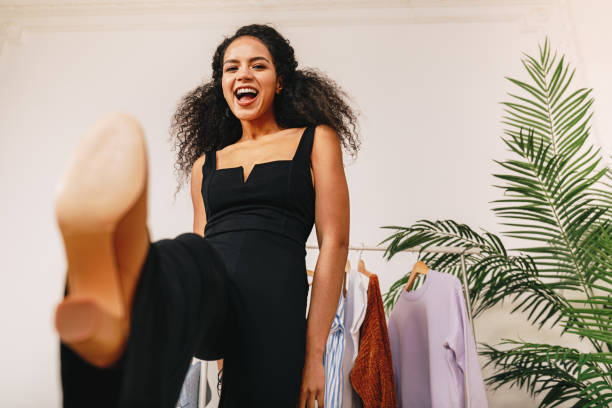 istock Happy personal stylist kicking a camera in studio 1157003311