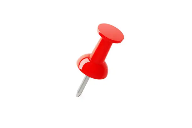 Red push pin on white background. High angle view. Isolated on white background with copy space.