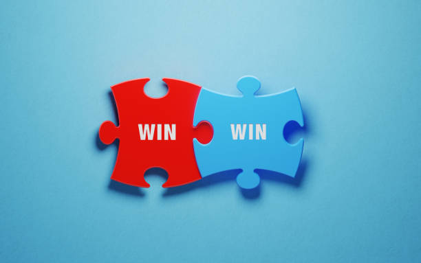 istock Win Win concept - Colorful Jigsaw Puzzle Pieces On Blue Background 1157007834