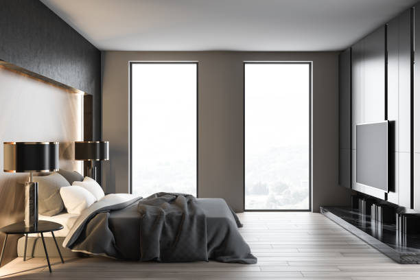 istock Loft white and gray bedroom interior with TV 1157008002