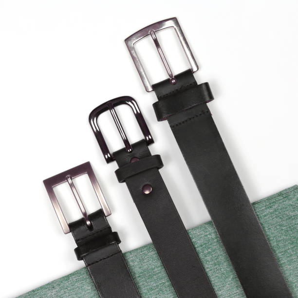 istock three black leather belt on a white background with jeans 1157008972