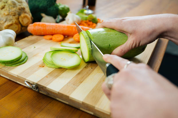 istock Woman in the Kitchen Chopping Some Veggies 1157017042