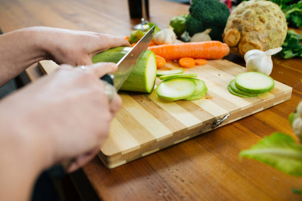 istock Woman in the Kitchen Chopping Some Veggies 1157017072