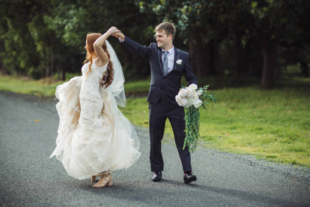istock Wedding Couple Dancing on Country Road 1157018482