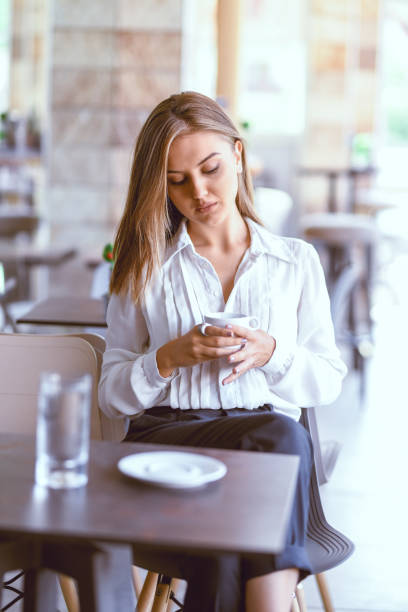 istock Cute Female Waking Up With Coffee In Bar 1157018966