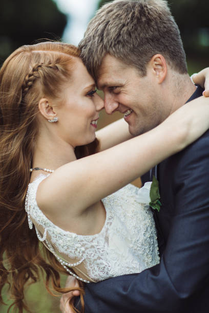 istock Young Wedding Couple in Rural Orchard 1157020755