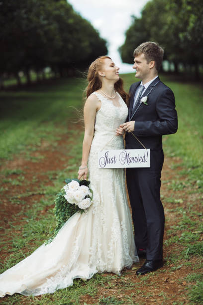 istock Couple Holding Just Married Sign 1157020903
