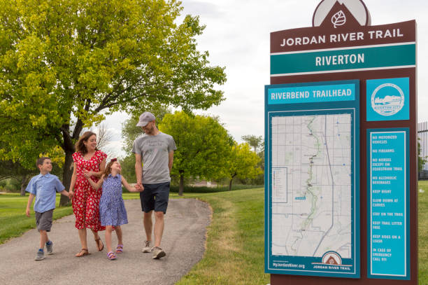 happy family out for a walk on the jordan river trail in riverton utah - child women outdoors mother imagens e fotografias de stock