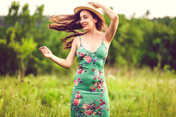 istock Happy woman in fields 1157022160