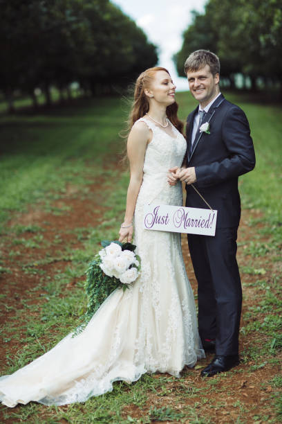 istock Couple Holding Just Married Sign 1157022375