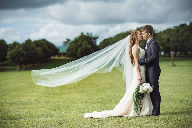 istock Wind Blowing Veil of Bride in Rural Field 1157022402