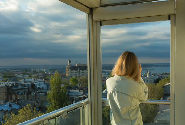 istock young woman on the balcony 1157024549