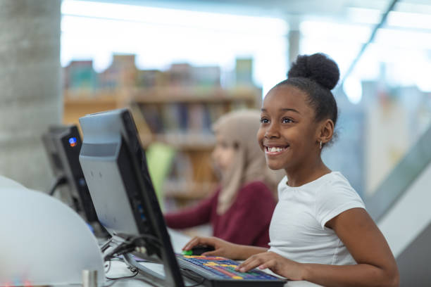 istock Smiling computer girl portrait 1157025444