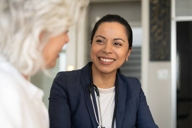 istock Female doctor with senior patient 1157025646