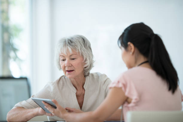 istock Senior woman meets with her physician 1157026636