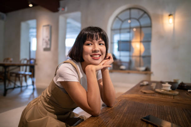 istock Young Asian woman relaxing in cafe 1157026734