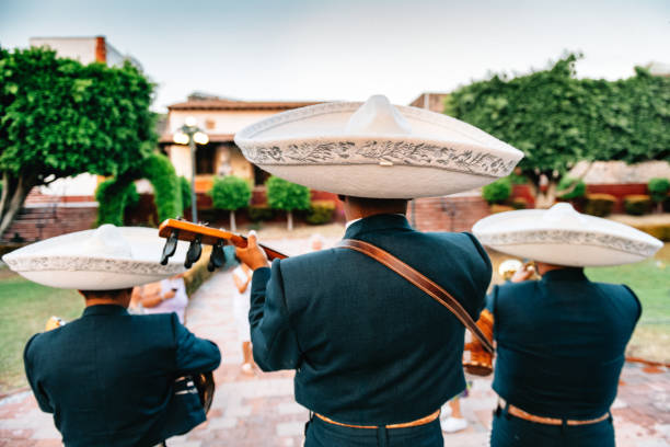 Mariachi Band Playing Mariachi Band Playing under Mexican Kiosk traditional musician stock pictures, royalty-free photos & images