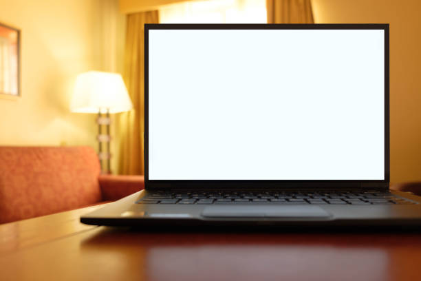 istock Laptop computer on desk in cozy hotel room 1157036783
