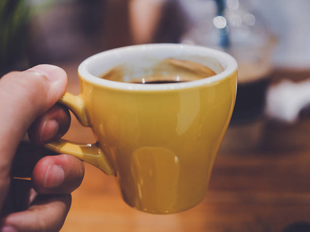 istock women holding coffee cup 1157037760