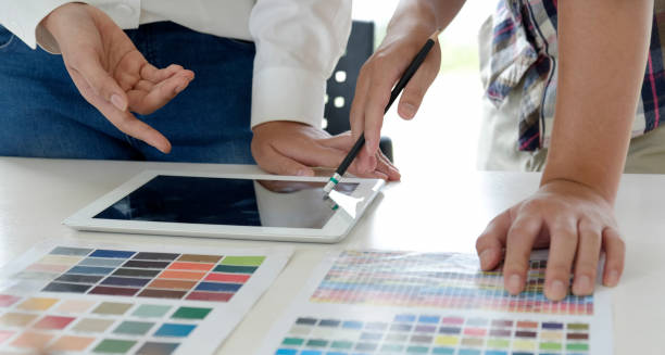 istock Designer colleagues working with tablet at co-working space 1157041447
