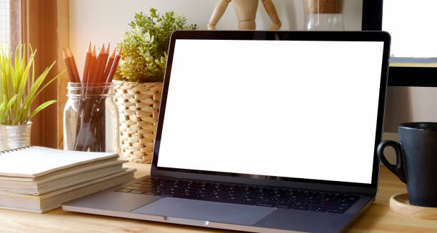istock Mockup laptop Comfortable work table in workspace. Blank screen for graphic montage.