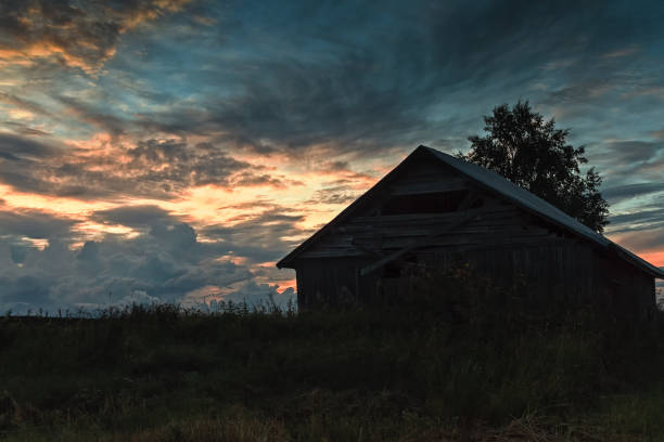 The clouds create dramatic formations on the autumn sky when the sun sets at the rural Finland.