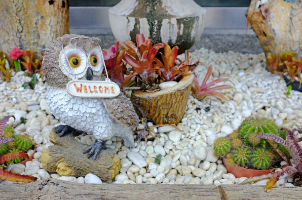 Welcome sign in the small garden.