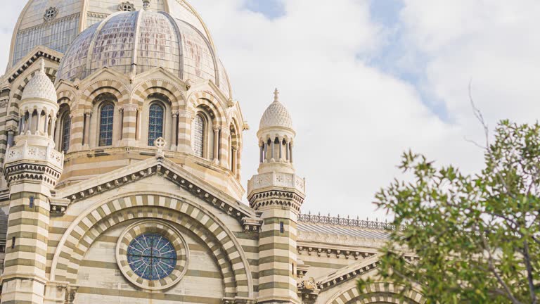 timelapse footage of cathedrale major with moving cloud blue sky Marseille Cathedral is a Roman Catholic cathedral, and a national monument of France