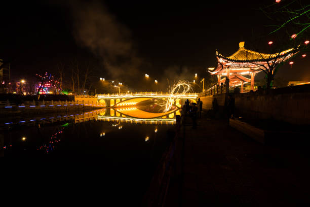 istock night scenery of bridge and river 1157050988