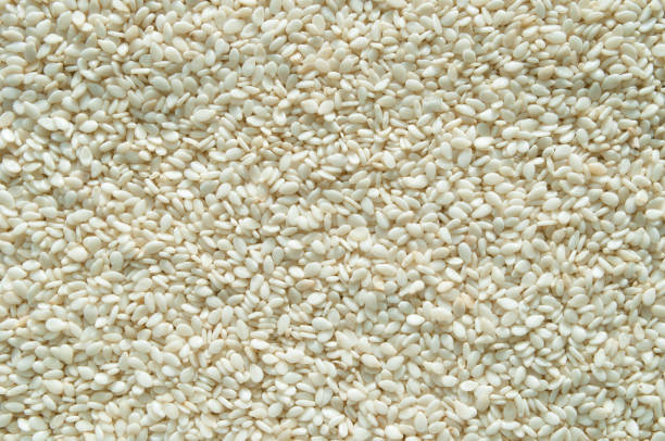 istock White sesame seeds for cooking top view, background. 1157051128