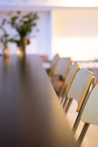 istock Row of chairs at dinner table 1157051428