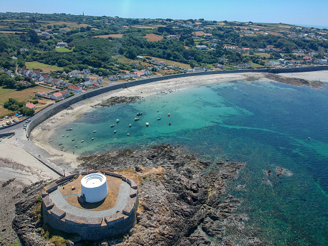 Aerial view Fort grey, built in 1804 to defend the west coast of Guernsey. wonderful beach with white sand and turquoise water and fisher boats