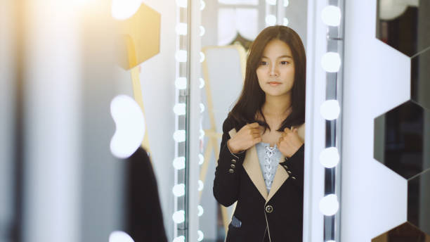 istock Young businesswoman getting ready to go out 1157055374