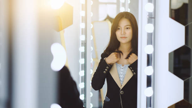 istock Young businesswoman getting ready to go out 1157055432