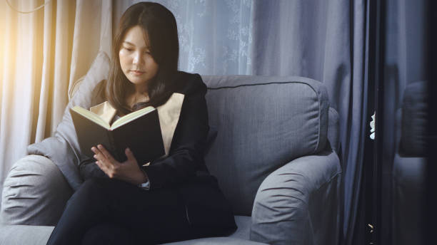 istock woman sitting on the sofa use laptop thinking feel happy typing 1157055523
