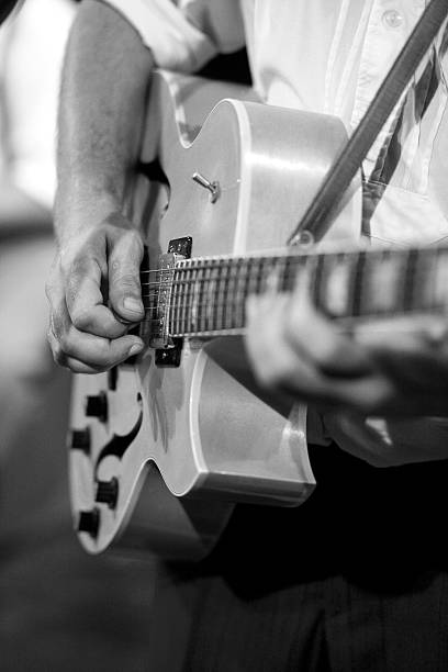 istock musician with jazz guitar 115705565