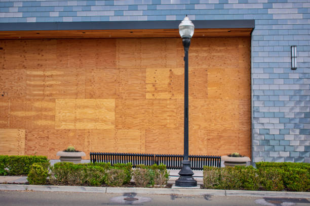 istock Office, store, restaurant boarded up with plywood sheets 1157056674