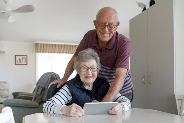 istock Senior Australian Couple Learning To Use Digital Tablet 1157058379