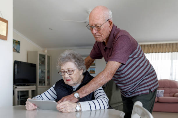 istock Senior Australian Couple Learning To Use Digital Tablet 1157058391