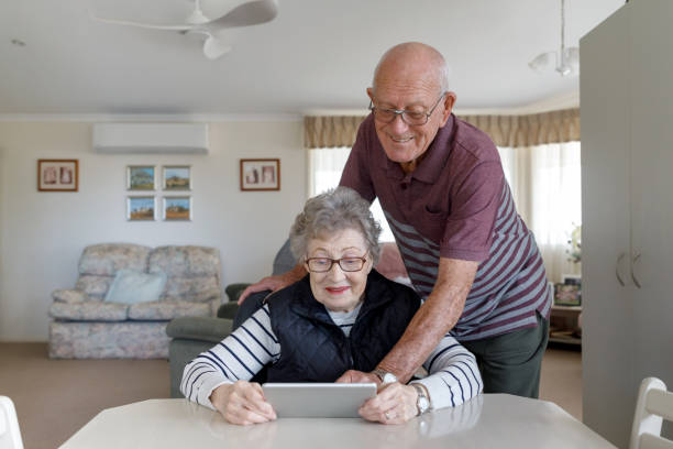 istock Senior Australian Couple Learning To Use Digital Tablet 1157058393