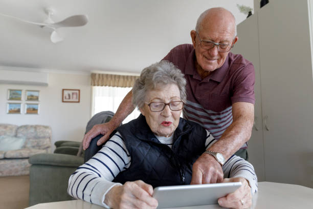 istock Senior Australian Couple Learning To Use Digital Tablet 1157058396