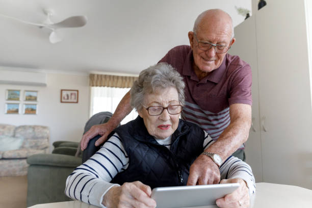 istock Senior Australian Couple Learning To Use Digital Tablet 1157058397